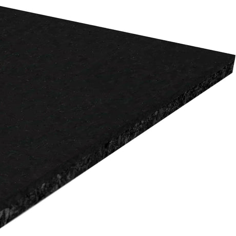 A close-up of the ECORE Athletic Performance Motivate Plus Rubber Roll - 10.5mm Flooring shows its rectangular, textured black surface at an angle against a white background.