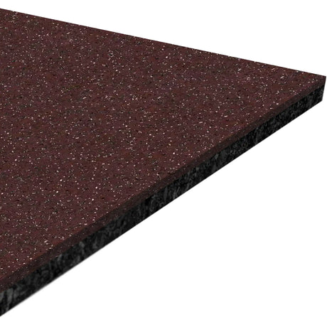 A close-up of a triangular section of the ECORE Performance Motivate Plus Rubber Roll - 10.5mm Flooring by ECORE Athletic shows its maroon, speckled surface and black, textured underside.