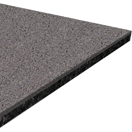A close-up of the ECORE Performance Motivate Plus Rubber Roll - 10.5mm Flooring by ECORE Athletic, featuring a rectangular, dark gray speckled surface shown at an angle on a white background.