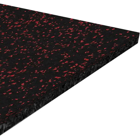 A close-up of the ECORE Athletic Performance Motivate Plus Rubber Roll - 10.5mm Flooring shows its rectangular black surface with small red flecks, viewed from an angle against a white background.