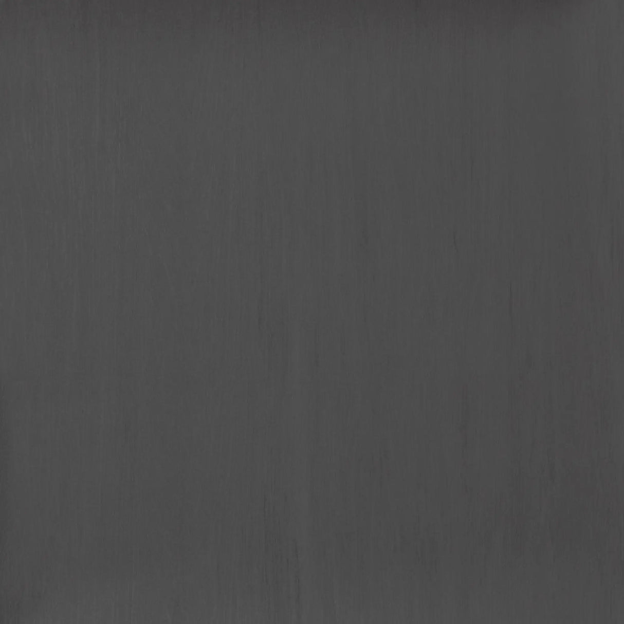 ECORE Athletic’s Moxie Beast Laminate Roll – 10.5mm Flooring features a dark gray, matte surface with subtle vertical streaks and a smooth, slightly textured finish.