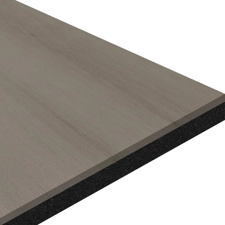 A close-up of the ECORE Athletic ECORE Moxie Motivate Laminate Roll - 10.5mm Class 1 Flooring shows its rectangular light gray wood grain surface and dark solid core from an angled side view against a white background.