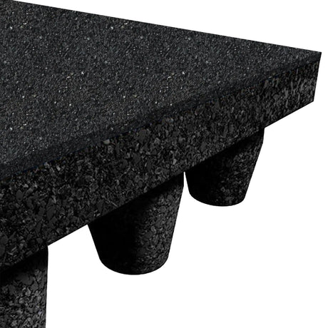 Close-up of the ECORE PlayGuard Rubber Tile - 2.5" Playground Flooring by ECORE Athletic, featuring a black, textured rubber surface with four cone-shaped feet underneath for elevation and support against a plain white background.