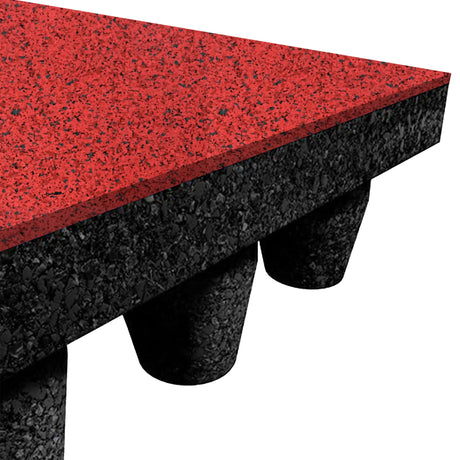 Close-up of the ECORE Athletic PlayGuard Rubber Tile - 2.5" Playground Flooring, showing its red speckled top layer and black textured base with round support columns underneath.