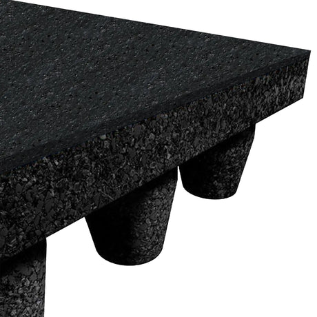 Close-up of the ECORE Athletic PlayGuard Rubber Tile 2.5" Playground Flooring—thick, black, textured surface with cylindrical support feet underneath, partially visible against a white background.