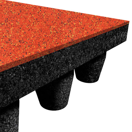 Close-up of ECORE Athletic's PlayGuard Rubber Tile - 2.5" Playground Flooring, showing a speckled orange top layer over a black base with cone-shaped supports underneath.