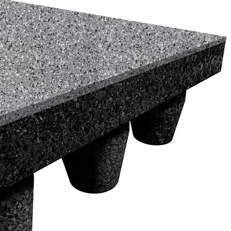 Close-up of an ECORE Athletic PlayGuard Rubber Tile 2.5" playground flooring in speckled gray, featuring a rectangular tabletop and black cylindrical support cones visible underneath to show cross-section materials and textures.
