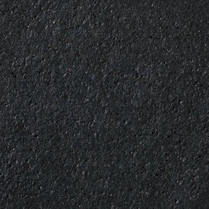 Close-up of ECORE PlayGuard Rubber Tile - 2.5" Playground Flooring by ECORE Athletic, showing its rough, dark textured surface with small specks and uneven areas throughout.