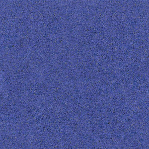 A close-up of the ECORE PlayGuard Rubber Tile - 2.5" Playground Flooring by ECORE Athletic shows a textured blue surface with grainy, speckled details in darker and lighter shades.