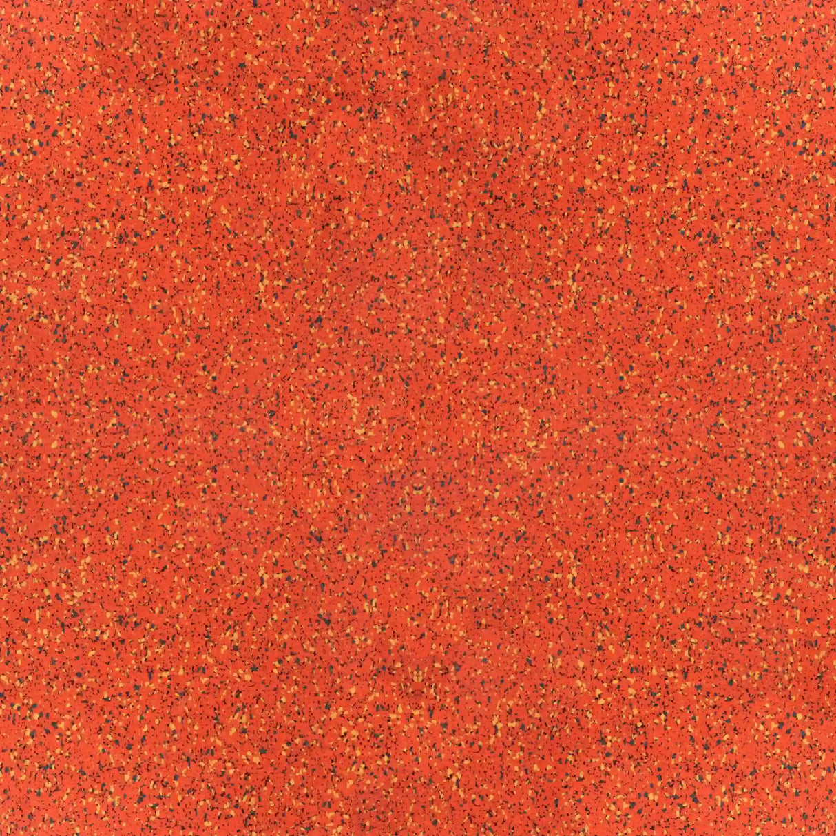 Close-up of ECORE PlayGuard Rubber Tile - 2.5" Playground Flooring by ECORE Athletic, featuring a vibrant red speckled texture with evenly scattered yellow, black, and orange dots for an abstract patterned background.