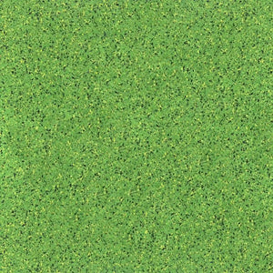 A close-up of ECORE Athletic’s PlayGuard Rubber Tile 2.5" Playground Flooring shows a green, textured surface with specks in various shades, resembling artificial turf.