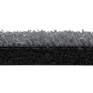 Side view of ECORE RageTurf Rally Interlocking Tile by ECORE Athletic, showing gray artificial grass fibers atop a thick, dark base layer, illustrating the 12mm tile’s turf structure and texture.