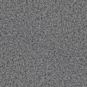 A close-up of the ECORE RageTurf Rally Interlocking Tile by ECORE Athletic shows a dense, textured 12mm athletic turf surface with many small, gray, rice-shaped fibers forming a uniform yet energetic pattern.