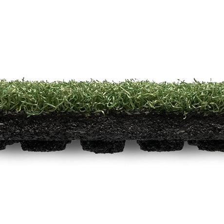 A side view of the ECORE RageTurf UltraTile - 1" Athletic Turf Tile by ECORE Athletic, featuring green synthetic blades and a thick black base, displayed against a white background.