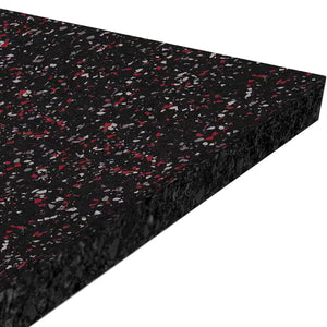 A close-up of the ECORE Performance Rally Rubber Roll - 14.5mm Flooring by ECORE Athletic: a thick, rectangular black mat with red and gray speckles, viewed at an angle against a white background.