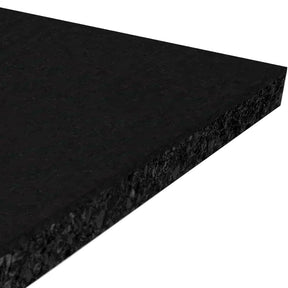 A close-up view of the ECORE Performance Rally Rubber Roll - 14.5mm Flooring by ECORE Athletic highlights its rectangular, flat black rubber form with a textured surface, showcasing the thickness and edges from an angled perspective.