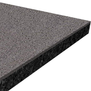 Close-up of the corner of an ECORE Athletic Performance Rally Rubber Roll - 14.5mm Flooring slab, showing its smooth surface with small, speckled light and dark rubber grains.