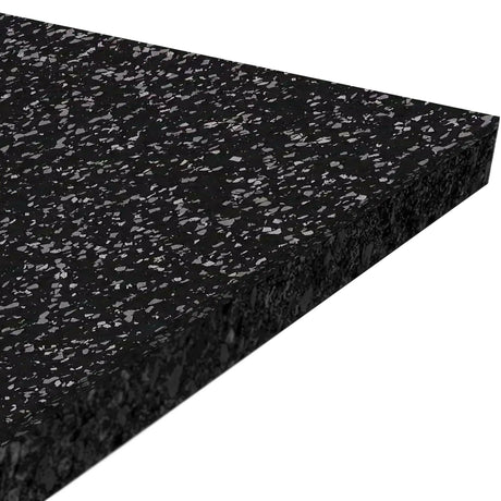 Close-up of the ECORE Performance Rally Rubber Roll - 14.5mm Flooring by ECORE Athletic, a thick rectangular black mat with gray speckles, displayed at an angle against a white background.