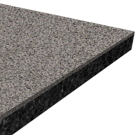 Close-up of the corner of an ECORE Performance Rally Rubber Roll - 14.5mm Flooring by ECORE Athletic, highlighting its thick, textured surface with speckled gray and black colors.