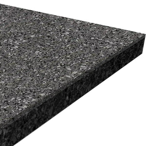 A close-up of the ECORE Athletic ECORE Performance Rally Rubber Roll - 14.5mm Flooring shows its rectangular shape, black speckled texture, thickness, and slightly angled edges.