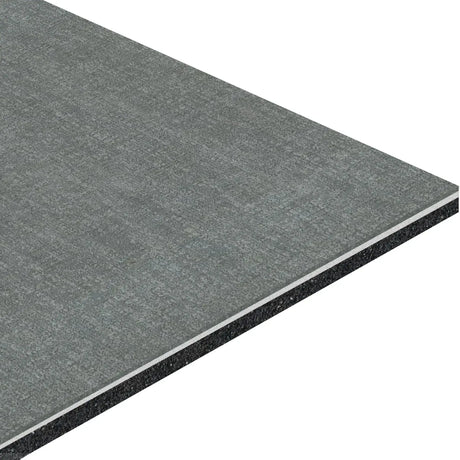 A close-up shows the layered construction of the ECORE Restorative Motivate Laminate Roll - 7mm Class 1 Flooring by ECORE Athletic, featuring a gray textured surface and black inner core.