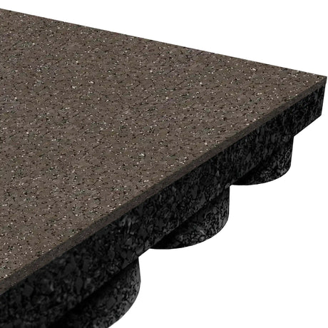 Close-up of the ECORE Performance UltraTile - 1" Rubber Tile by ECORE Athletic, featuring a rectangular, brown design with a textured top and scalloped underside for enhanced grip or shock absorption, ideal for gym or playground flooring.