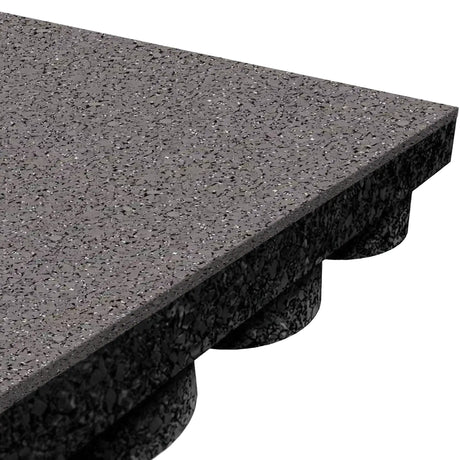Close-up of an ECORE Performance UltraTile - 1" Rubber Tile by ECORE Athletic, highlighting its gray speckled textured surface and the underside with circular stubs for a secure interlocking connection to adjacent tiles.