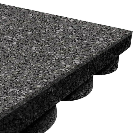 Close-up of an ECORE Performance UltraTile - 1" Rubber Tile by ECORE Athletic, featuring a black speckled textured surface and interlocking underside with raised circular connectors for secure gym flooring installation.
