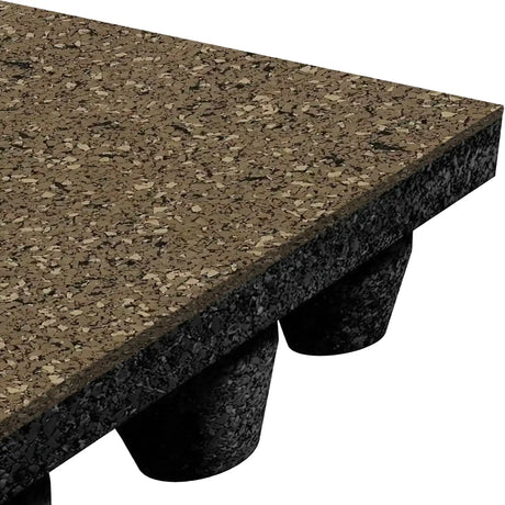 A close-up of the ECORE Athletic ECORE Performance dBTile Rubber Tile - 2.5" Acoustic Flooring, showing its speckled brown and black textured surface with a black underside featuring evenly spaced conical supports.