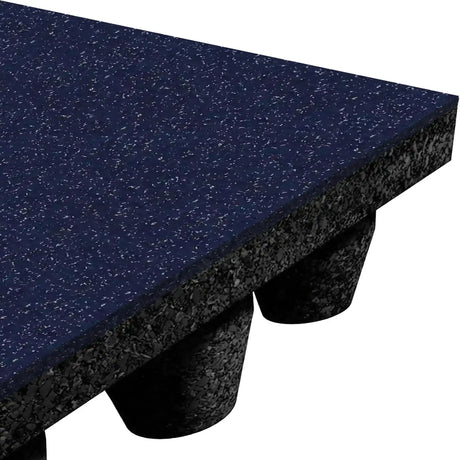 Close-up of ECORE Performance dBTile Rubber Tile by ECORE Athletic: a blue speckled, textured 2.5" acoustic mat with a layered underside and cylindrical support columns, ideal for gym or playground flooring.
