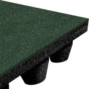 Close-up of the ECORE Performance dBTile Rubber Tile – 2.5" Acoustic Flooring by ECORE Athletic, showing its thick green, textured surface and underside with black cylindrical supports that elevate the mat off the ground.