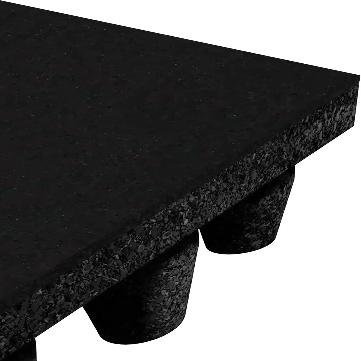Close-up of ECORE Athletic’s Performance dBTile Rubber Tile - 2.5" Acoustic Flooring, showing its thick, textured black surface and cylindrical feet for elevation and support. Only a corner of the mat and some feet are visible.