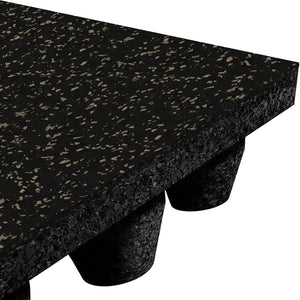 A close-up of the ECORE Athletic ECORE Performance dBTile Rubber Tile - 2.5" Acoustic Flooring in black, with beige and gray flecks, a textured surface, and elevated cylindrical supports on the underside.