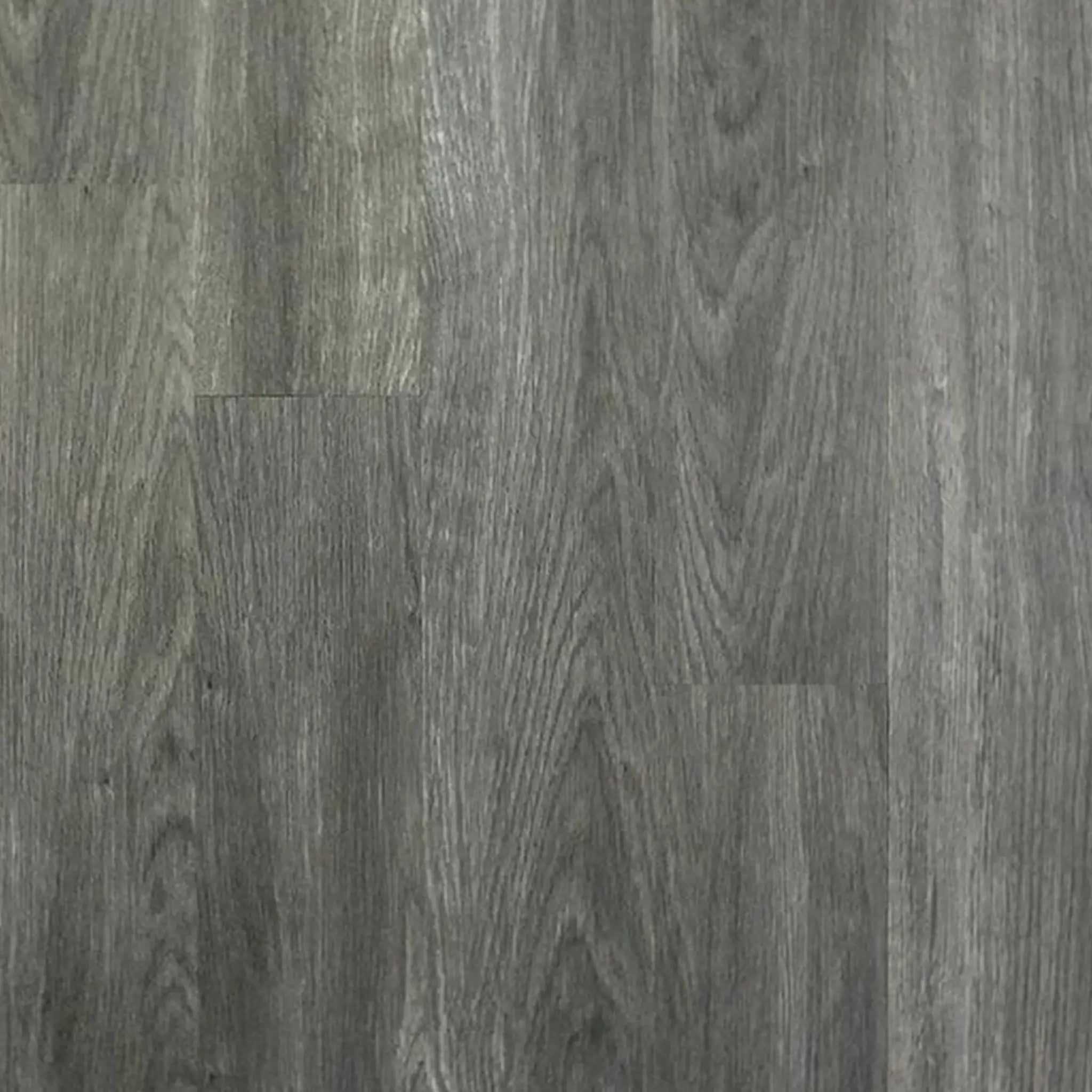 Close-up of ECORE Heritage Motivate Vinyl Plank - 7mm PVT Performance Flooring by ECORE Athletic, featuring gray wood grain, natural texture, and varied shades that authentically replicate real wood.