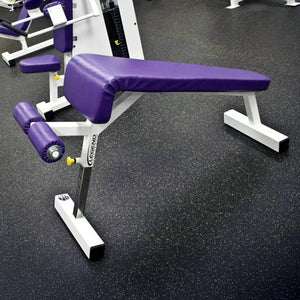 Purple weight bench with white legs on a gym floor