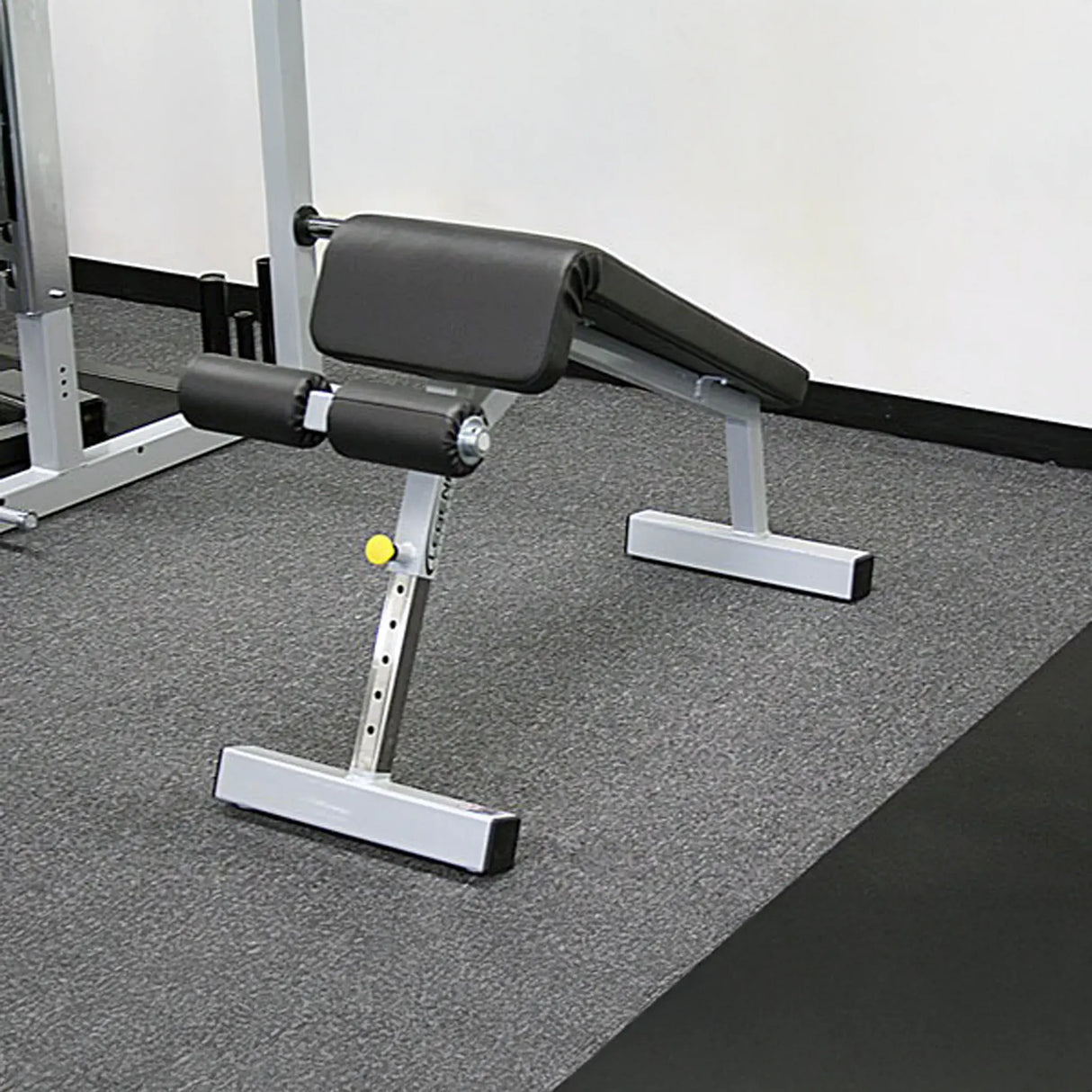 Adjustable weight bench in a gym setting
