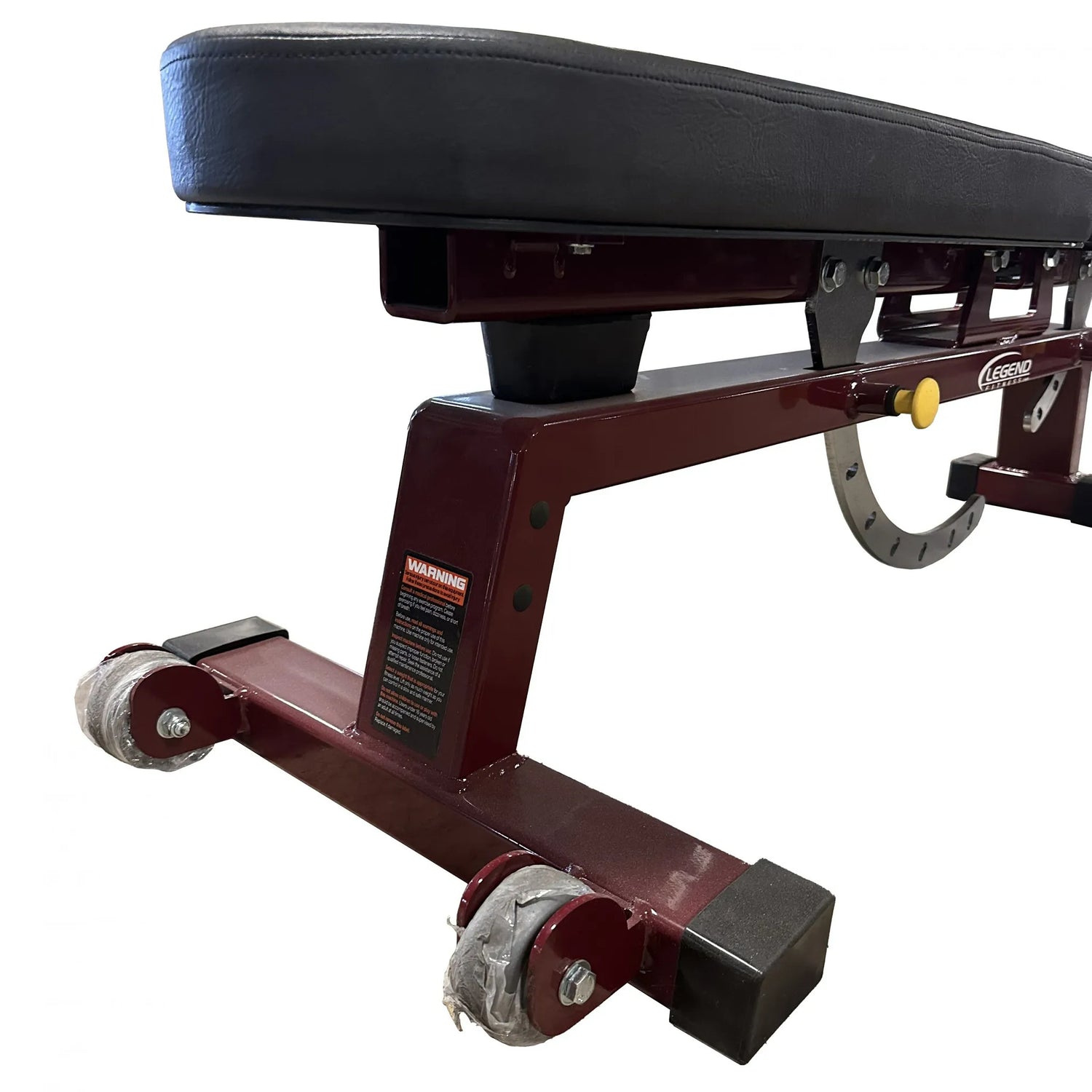 Black upholstered weight bench with a dark red frame on a white background