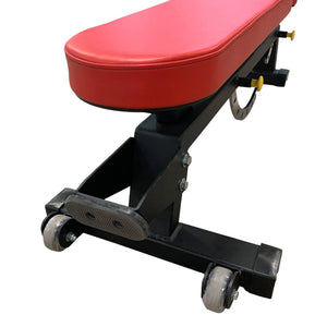 Closeup image of a red upholstered weight bench with a black frame on a white background