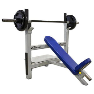 Blue incline weight bench with barbell on a white background