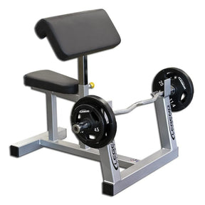 A silver and black curl pedestal with black plates and a silver bar on a white background