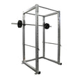 Gray power rack with barbell on a white background