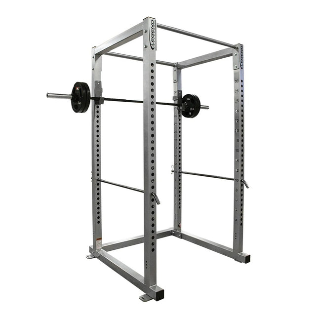 Gray power rack with barbell on a white background