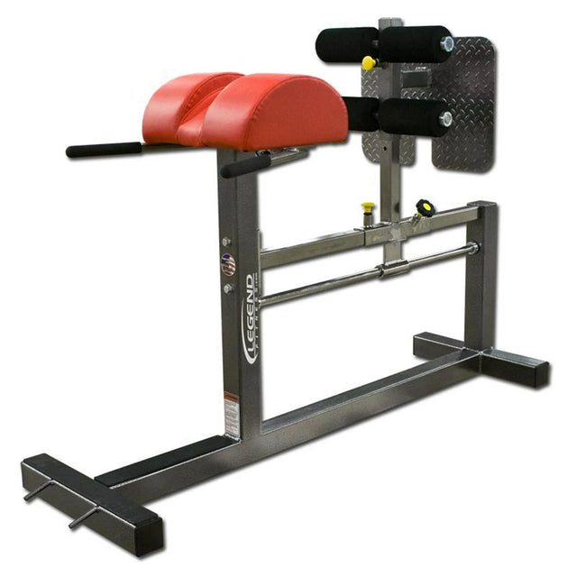 A red and Gray glute ham developer fitness machine on a white background