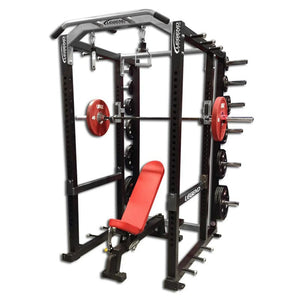 Gym power rack with red weight plates and bench on a white background