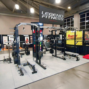 Gym equipment display with 'Legend Fitness' sign and Powerbar banner.