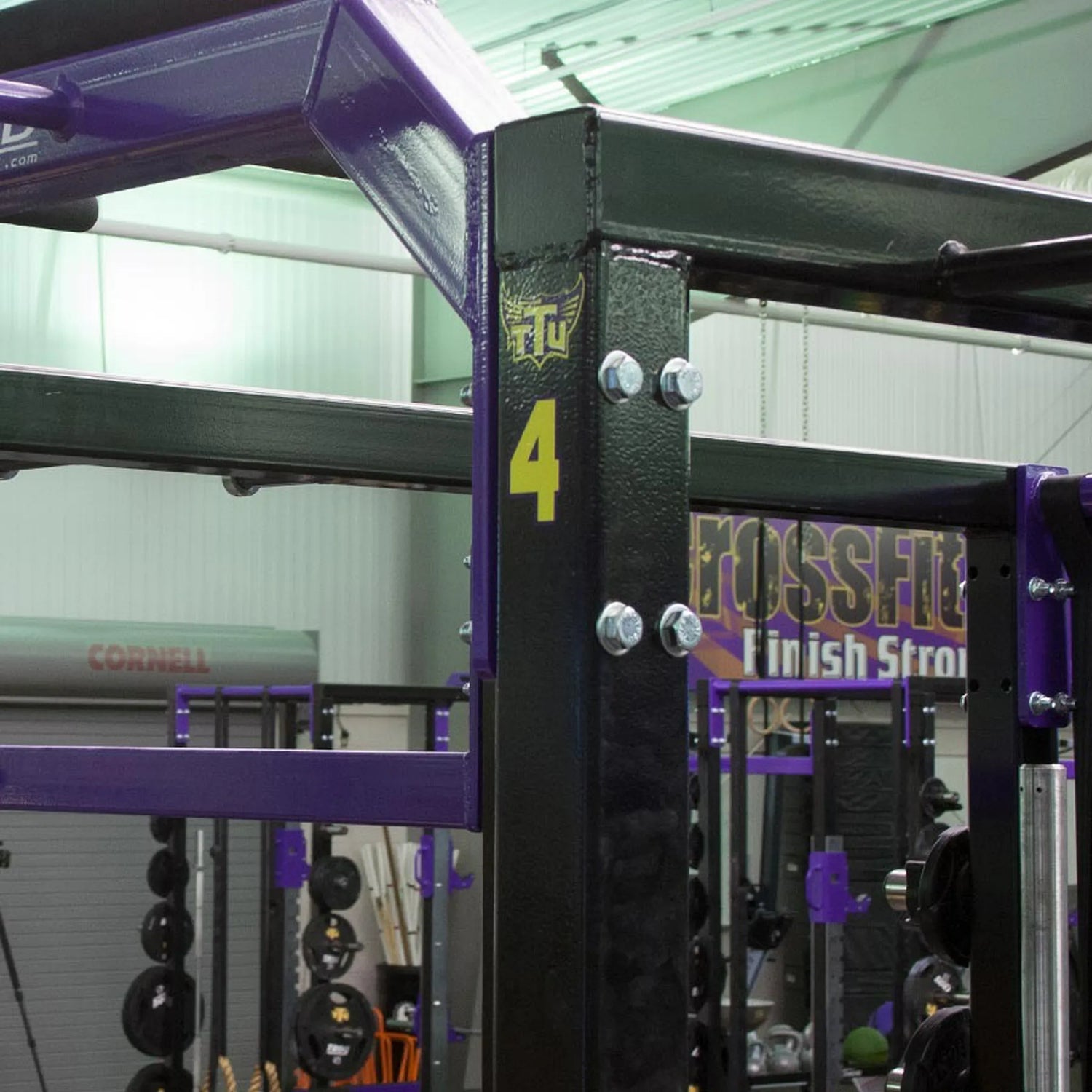 Gym equipment with a number '4' and 'TTU' branding in a fitness center.