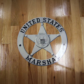 United States Marshal star badge on a wooden background