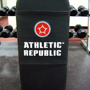 Black gym bench with 'Athletic Republic' logo in a gym setting