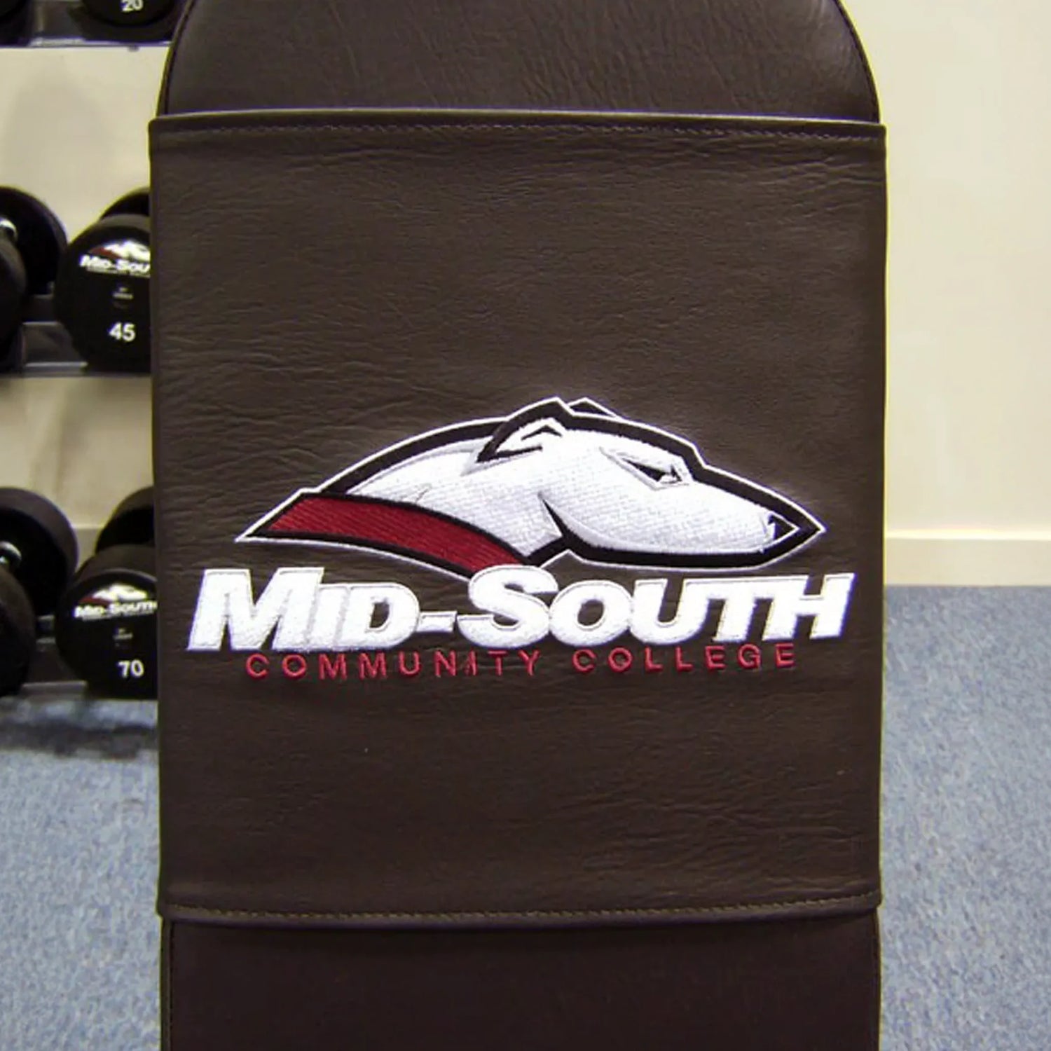 A black bench pad with a race hound and the words 
'Mid-South Community College' embroidered on it