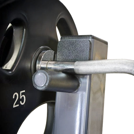Close-up of a gray metal frame with a silver curl bar and a black plate on a white background